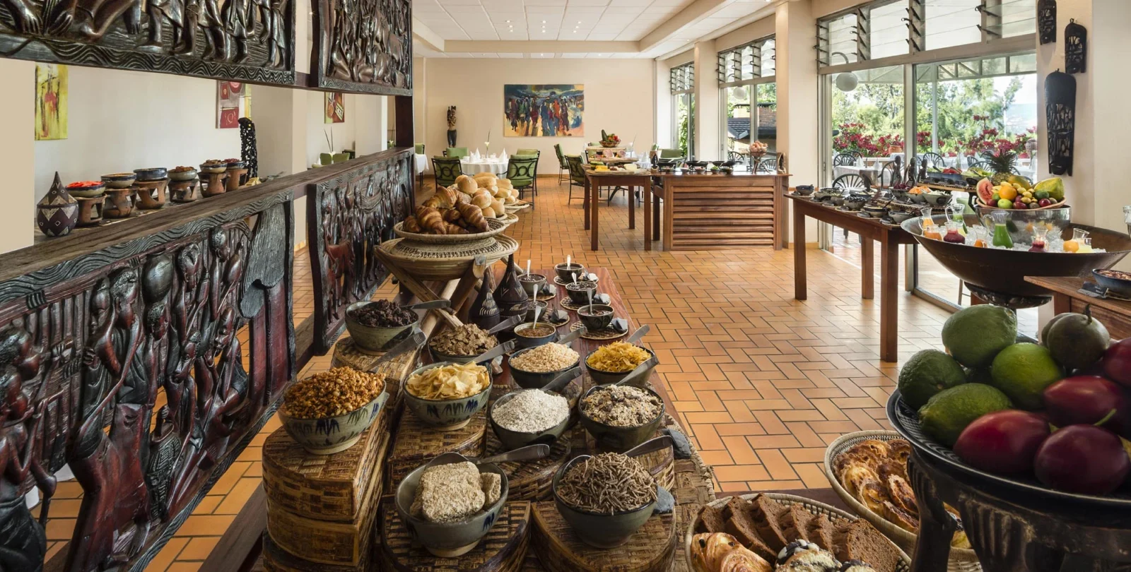 Hotel des Mille Collines restaurant table with traditional Rwandan food