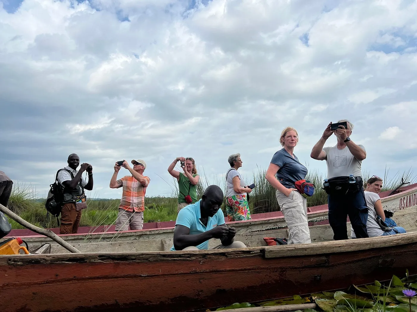Mabamba is explored slowly by canoe through papyrus and open water channels.